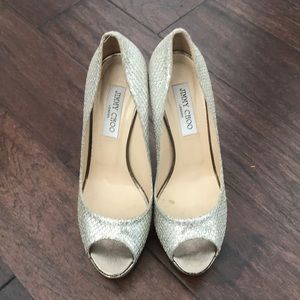 Silver Jimmy Choo peep-toe heels. Used